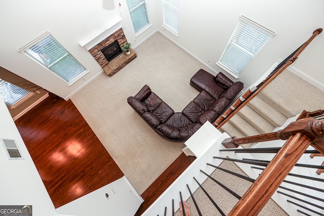 5310 Corinth Ct, Cumming, GA 30040 - unfurnished living room with a fireplace, visible vents, baseboards, and carpet floors