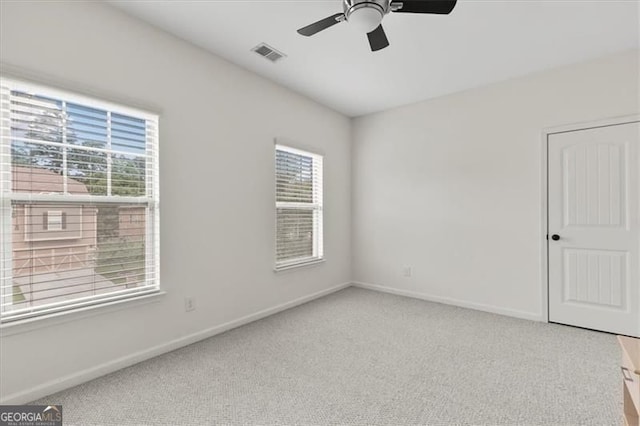 5310 Corinth Ct, Cumming, GA 30040 - unfurnished room featuring carpet flooring, baseboards, a ceiling fan, and plenty of natural light