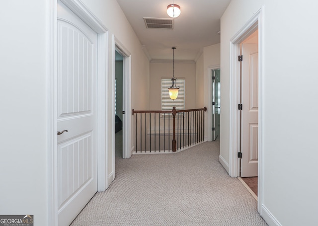 5310 Corinth Ct, Cumming, GA 30040 - hallway featuring crown molding, light colored carpet, baseboards, and visible vents
