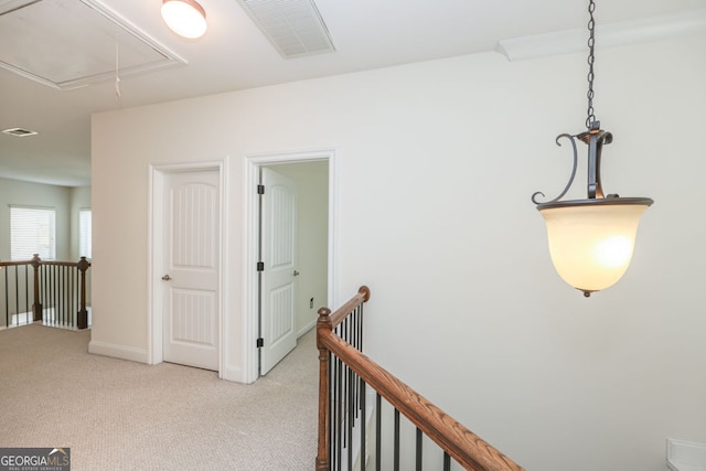 5310 Corinth Ct, Cumming, GA 30040 - hallway with light carpet, an upstairs landing, visible vents, and attic access
