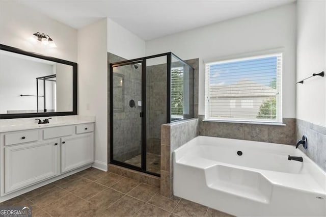 5310 Corinth Ct, Cumming, GA 30040 - full bath featuring tile patterned floors, vanity, a garden tub, and a stall shower
