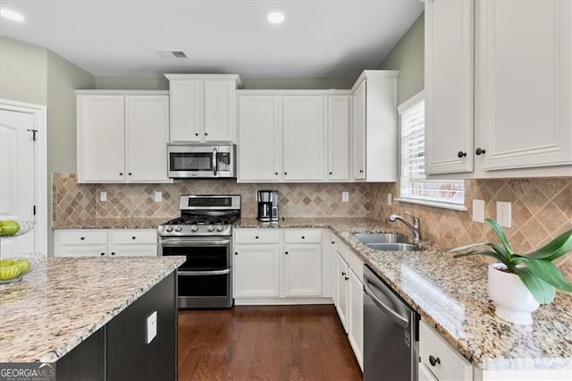 5310 Corinth Ct, Cumming, GA 30040 - kitchen featuring a sink, visible vents, white cabinetry, and stainless steel appliances