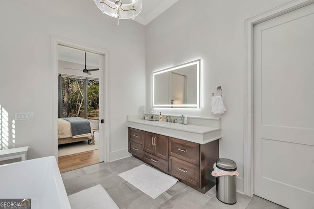 bathroom featuring vanity, an inviting chandelier, and ensuite bathroom