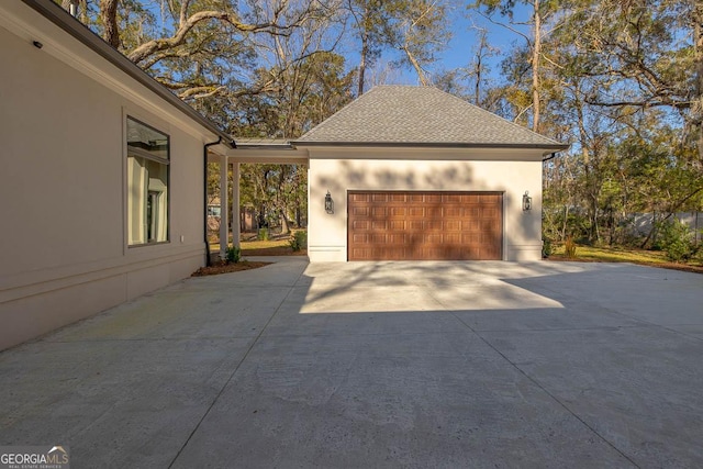 garage featuring driveway