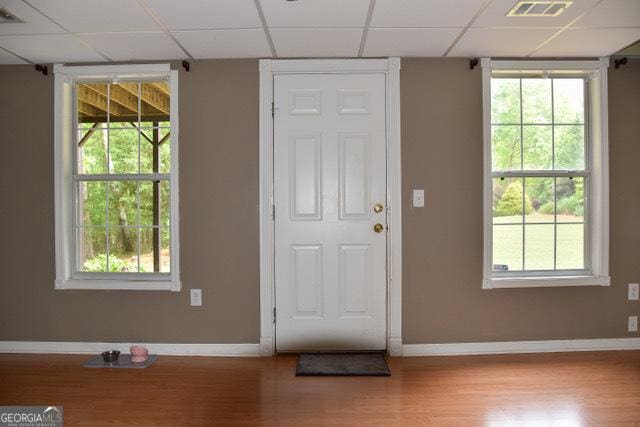 332 Black Willow Ct, Locust Grove, GA 30248 - foyer entrance featuring a paneled ceiling, wood finished floors, and baseboards