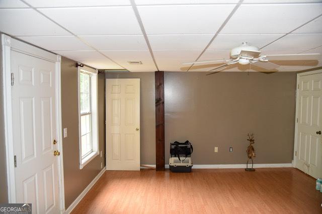 332 Black Willow Ct, Locust Grove, GA 30248 - entryway with light wood-style flooring, baseboards, a drop ceiling, and a ceiling fan