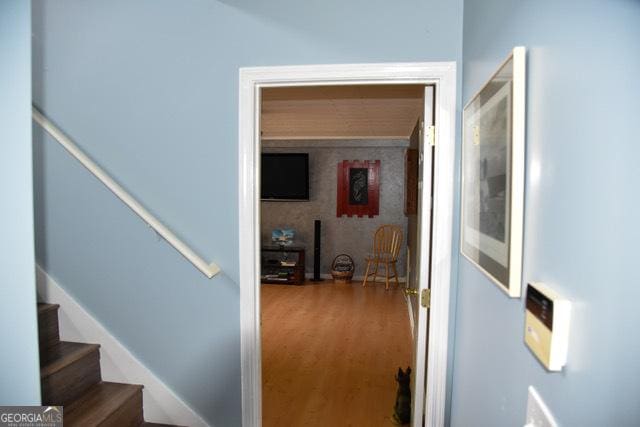 332 Black Willow Ct, Locust Grove, GA 30248 - hall featuring wood finished floors and stairs