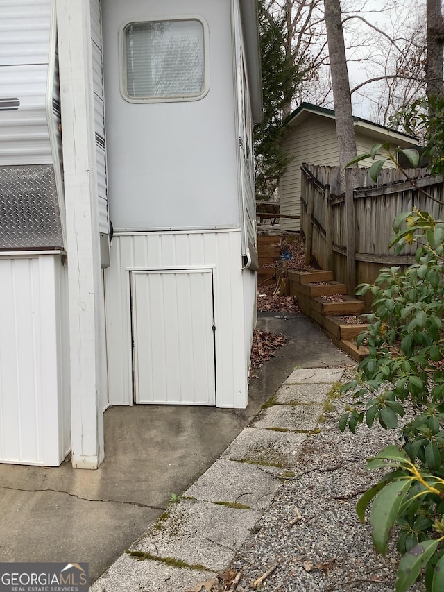 doorway to property with fence