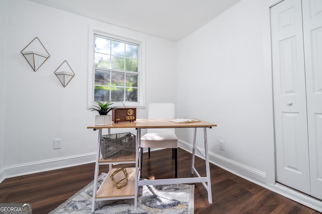 office space with wood finished floors and baseboards