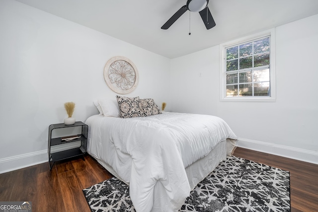 bedroom with wood finished floors, baseboards, and ceiling fan