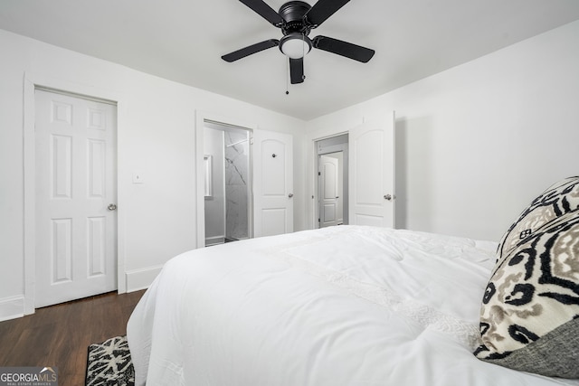 bedroom with connected bathroom, a ceiling fan, baseboards, and dark wood-style flooring