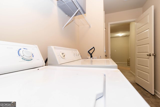 laundry room with independent washer and dryer and laundry area