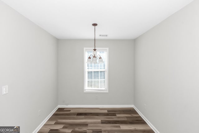 75 Heatherstone Way, Covington, GA 30016 - empty room featuring wood finished floors and baseboards