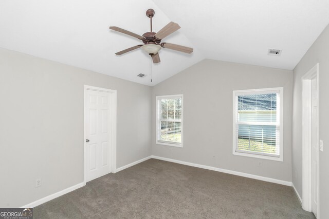 75 Heatherstone Way, Covington, GA 30016 - unfurnished bedroom featuring carpet floors, vaulted ceiling, and a ceiling fan