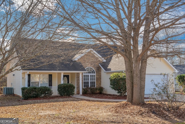 75 Heatherstone Way, Covington, GA 30016 - view of front of house with a porch, roof with shingles, and a garage