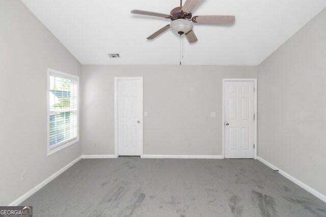 75 Heatherstone Way, Covington, GA 30016 - unfurnished bedroom featuring carpet floors, lofted ceiling, and a ceiling fan