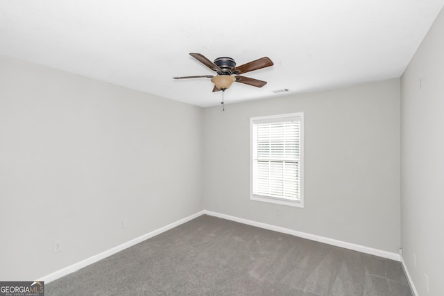 75 Heatherstone Way, Covington, GA 30016 - empty room with ceiling fan and dark colored carpet