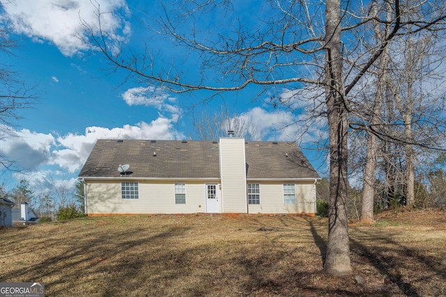 75 Heatherstone Way, Covington, GA 30016 - rear view of house featuring a chimney and a lawn
