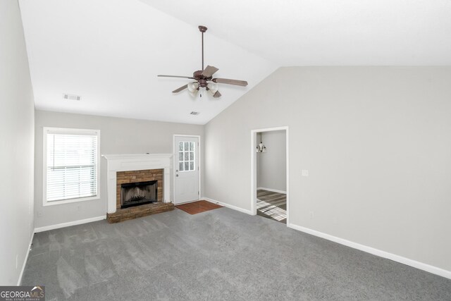 75 Heatherstone Way, Covington, GA 30016 - unfurnished living room featuring ceiling fan, a fireplace with raised hearth, plenty of natural light, carpet, and lofted ceiling