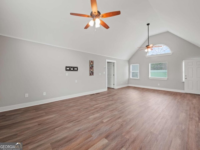 unfurnished living room featuring high vaulted ceiling, baseboards, ceiling fan, and wood finished floors