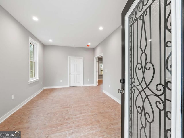 foyer entrance featuring recessed lighting, light wood-style floors, and baseboards