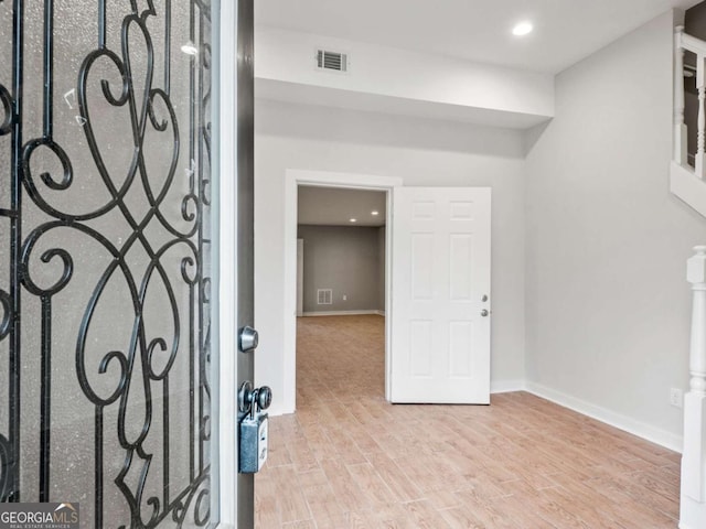 entrance foyer featuring visible vents, recessed lighting, baseboards, and wood finished floors