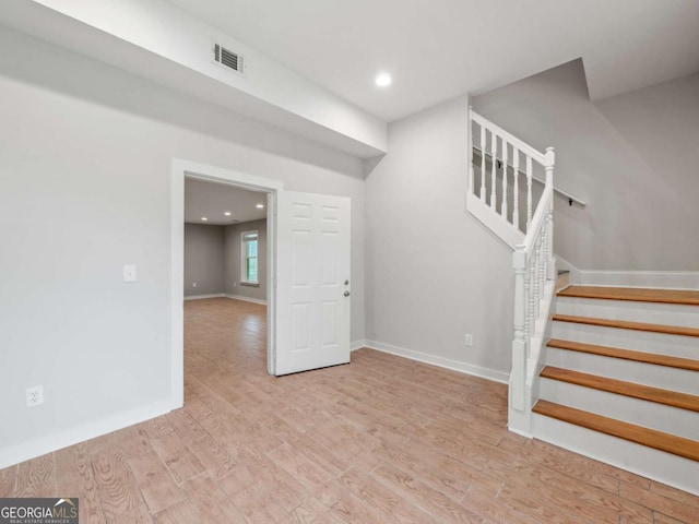 interior space with visible vents, recessed lighting, baseboards, and wood finished floors