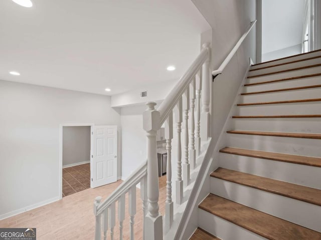 stairs featuring recessed lighting and baseboards