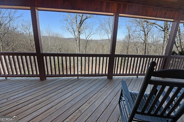 deck with a wooded view