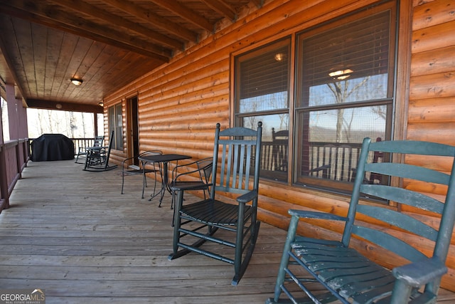 wooden terrace with a porch