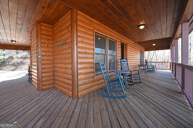 wooden terrace with a porch