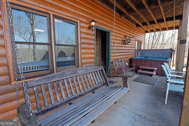 view of patio / terrace featuring a hot tub