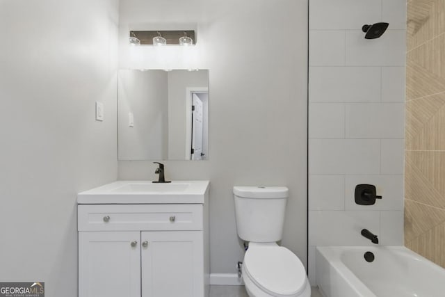 bathroom featuring shower / bathing tub combination, toilet, and vanity