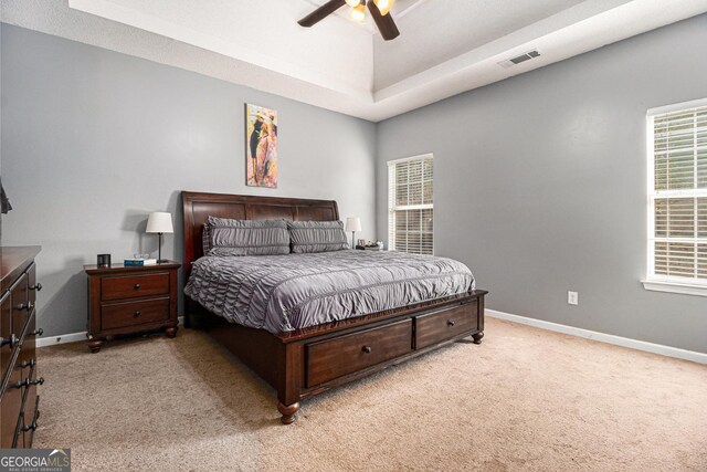 1921 Boulder Gate Dr, Ellenwood, GA 30294 - carpeted bedroom featuring visible vents, baseboards, and a ceiling fan
