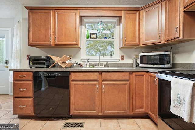 345 Lambeth Dr, Hiram, GA 30141 - kitchen with dishwasher, stainless steel microwave, a sink, stove, and brown cabinets
