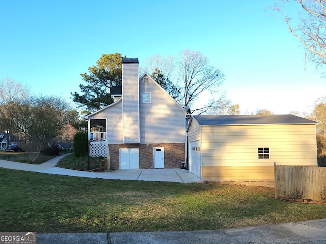 345 Lambeth Dr, Hiram, GA 30141 - view of side of home featuring a chimney, stone siding, and an attached garage