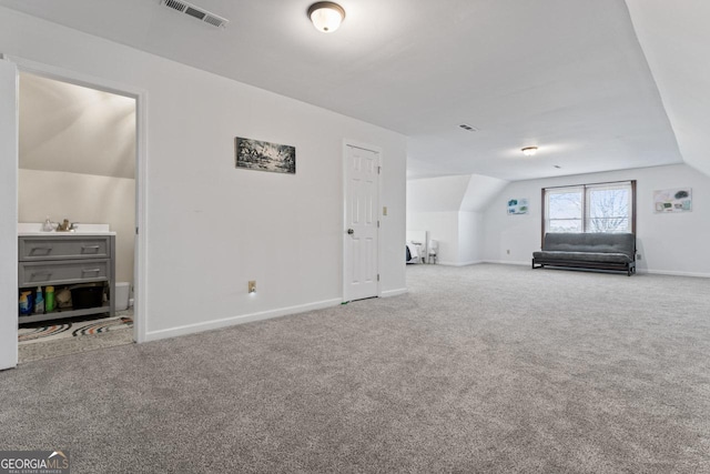 bonus room featuring vaulted ceiling, carpet, and visible vents