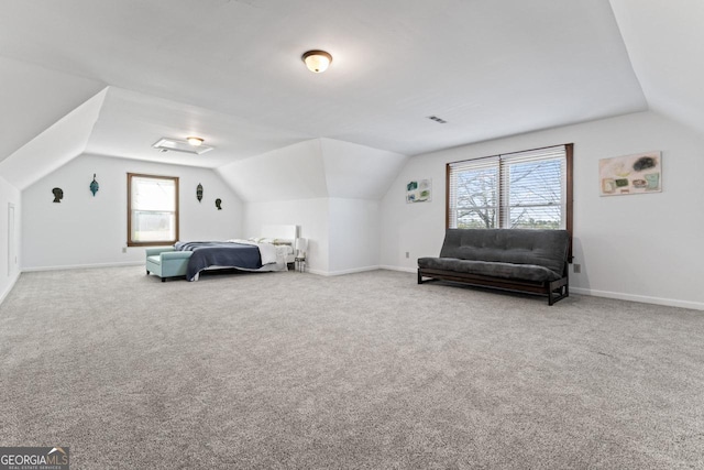 bedroom with lofted ceiling, carpet flooring, baseboards, and visible vents