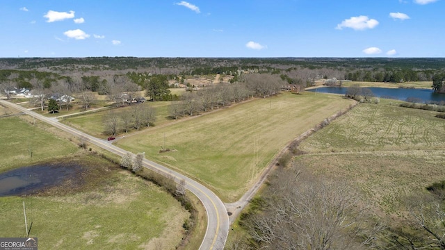 drone / aerial view featuring a rural view and a water view