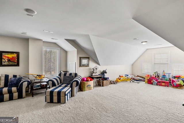 rec room featuring lofted ceiling and carpet