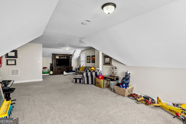 playroom with lofted ceiling, carpet flooring, baseboards, and visible vents