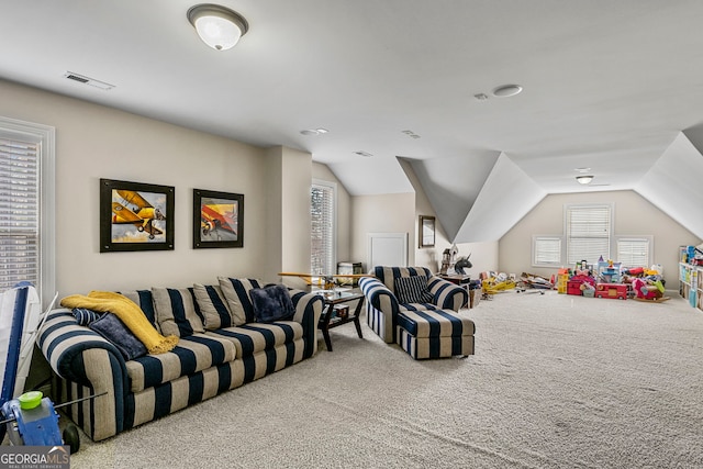 playroom featuring visible vents, carpet flooring, and vaulted ceiling