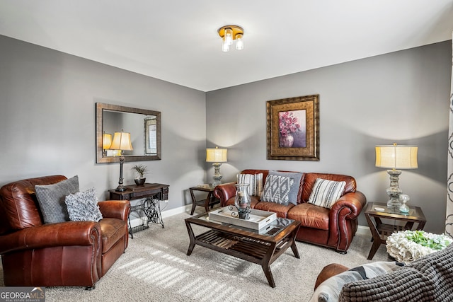 living area featuring carpet flooring and baseboards