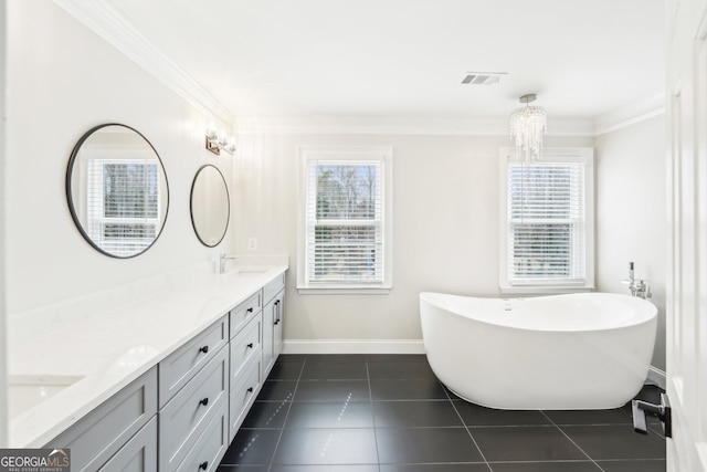 bathroom with tile patterned flooring, double vanity, visible vents, and ornamental molding