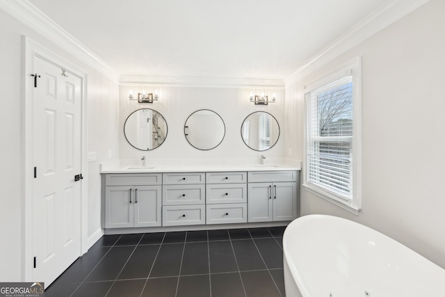 full bathroom featuring a sink, a soaking tub, ornamental molding, and double vanity