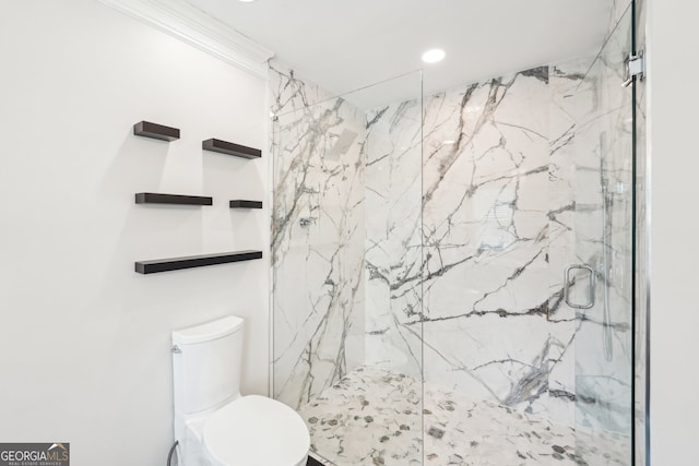 bathroom with recessed lighting, a marble finish shower, and toilet