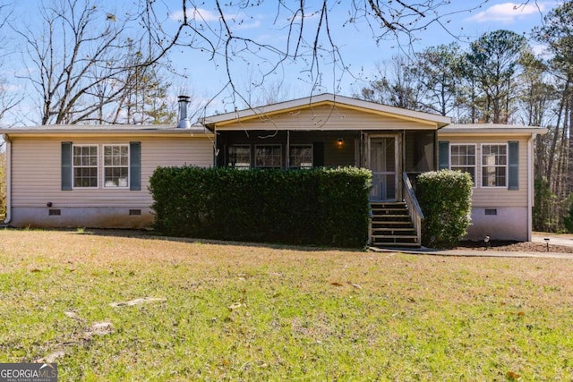 view of front of property featuring crawl space, a front yard, and a sunroom