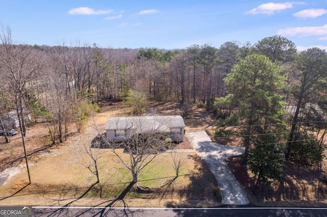 aerial view with a wooded view