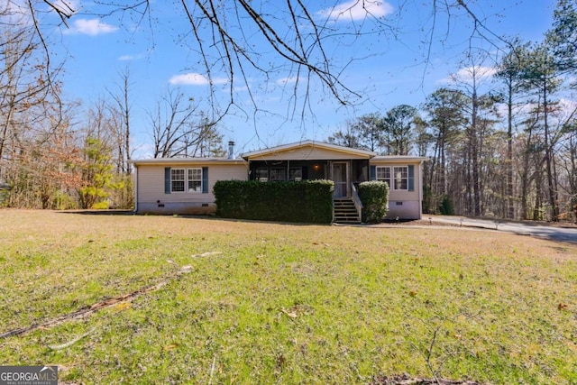 ranch-style home featuring crawl space, a front lawn, and a sunroom