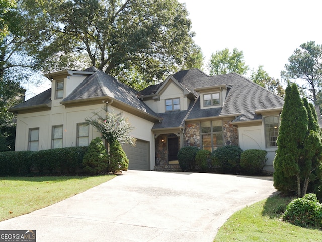 view of front of home with stucco siding, stone siding, a garage, and concrete driveway